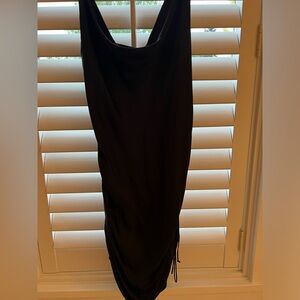 Black adjustable Aritzia slip dress.
